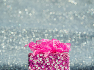 Close-up of pink gift box with bokeh blurry background