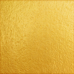 Shiny yellow gold wall texture background