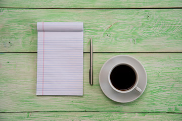 notebook with cup of coffee