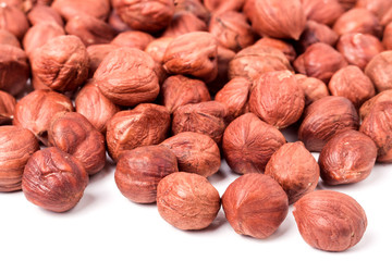 peeled hazelnuts isolated on white background macro