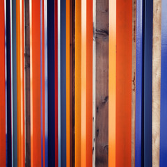 Colorful fence. Repeated wooden blocks. Aged photo. Abstract geometric background. Vintage filter...