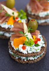 Canapes with prosciutto and cheese