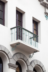 balcony with a window on white building