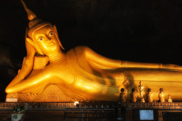 Reclining Buddha gold statue in Thailand