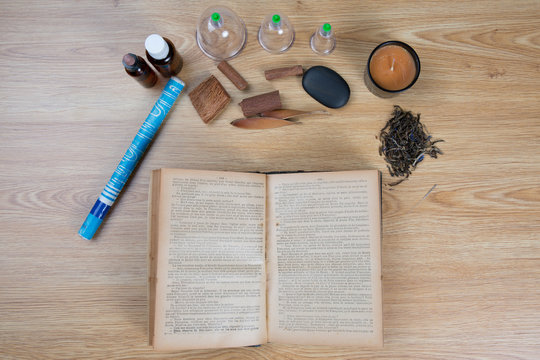 Traditional Chinese Medicine concept photo with old book