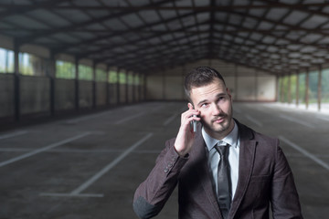 Beginning business man sitting in new premise for rent or empty