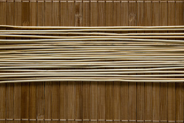 Wooden sticks on a wooden background