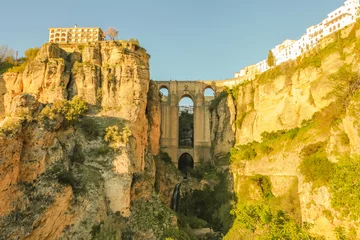 Wall murals Ronda Puente Nuevo The popular historic landmark of spectacular Puente Nuevo, New Bridge, at sunset over Guadalevin River in town of Ronda, Andalusia, Spain.