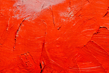 Red abstract brush stroke daub oil paint, textured acrylic background.