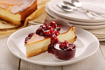 Cheesecake slice with cherry jam