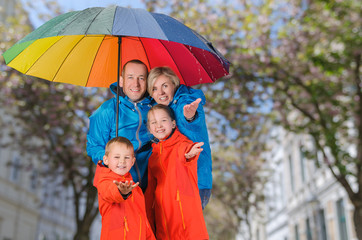 Colorful family have fun in rainy day
