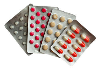Packs of pills isolated on white. stack of four different multic