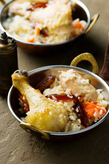 pilaf with chicken and pumpkin in a copper bowl