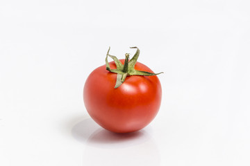 Fresh tomato  isolated on white