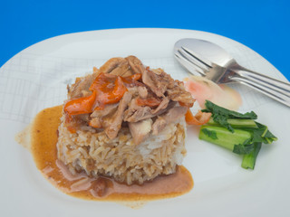 Chinese style roasted duck with rice and vegetable garnish