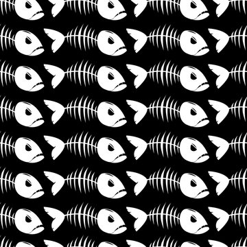 Seamless pattern with fish skeleton on black background.
