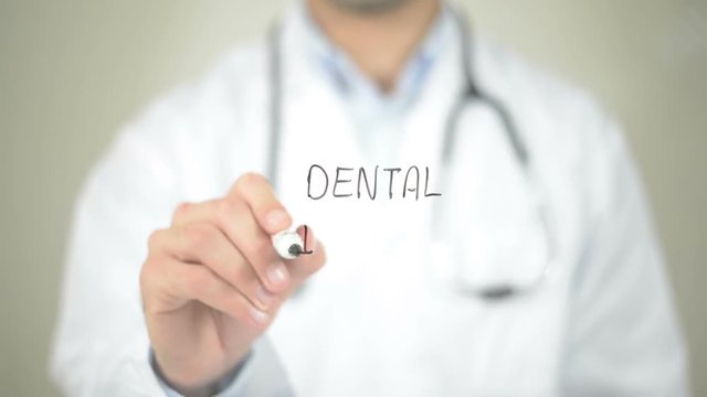 Dental Implant , Doctor writing on transparent screen