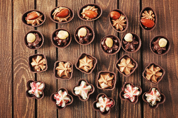 Chocolate sweets on wooden background