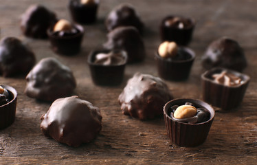 Chocolate sweets on wooden background