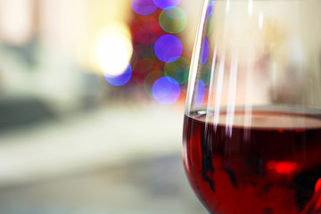 Glass of red wine on blurred background