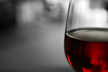 Glass of red wine on blurred background