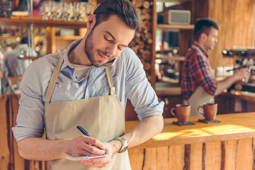 Handsome waiter at cafe