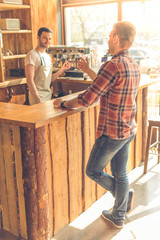 Handsome young man at cafe