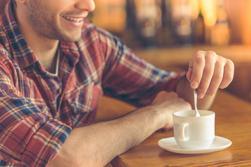 Handsome young man at cafe