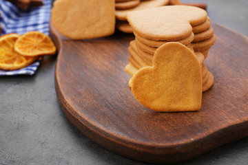 Heart shaped biscuits on cutting board, closeup