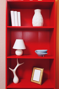 Bookcase with home decor closeup