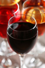 Glasses with wines of different colors on a table