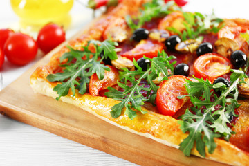 Rectangle delicious pizza on the table, close-up