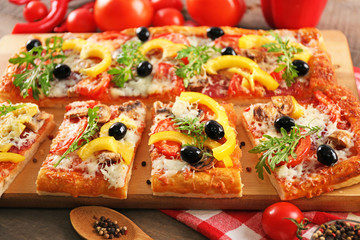 Pieces of delicious pizza on the table, close-up