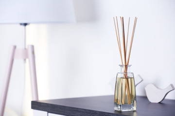 Handmade reed freshener on commode in living room, close up