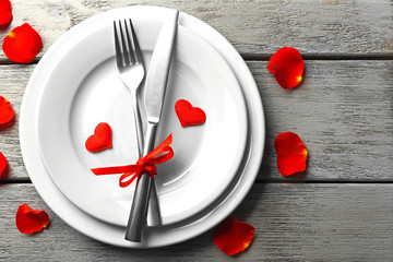 Festive table setting for Valentines Day on wooden background