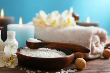 Spa treatments on wooden table against blue background