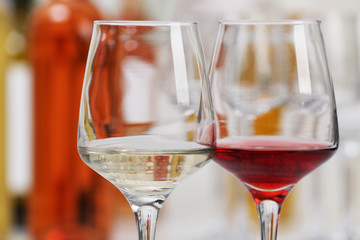 Wine glasses with red and white wine, closeup