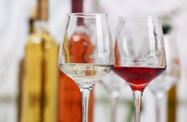 Wine glasses with red and white wine, closeup