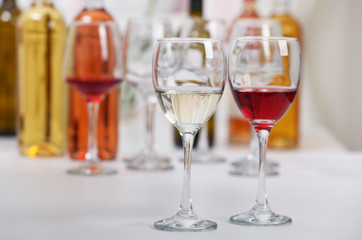 Wine glasses with red and white wine, closeup