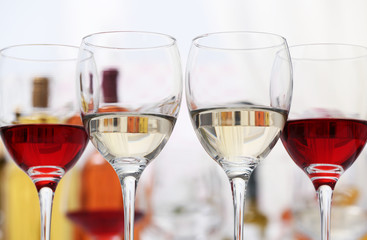 Wine glasses with red and white wine, closeup