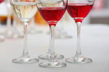Wine glasses with red and white wine, closeup