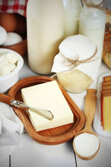 Set of fresh dairy products on white wooden table