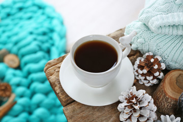 Beautiful winter composition with cup of hot drink