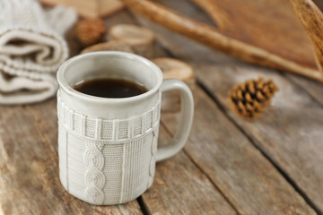 Beautiful winter composition with cup of hot drink