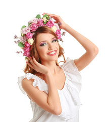 Beautiful young woman wearing floral headband isolated on white background