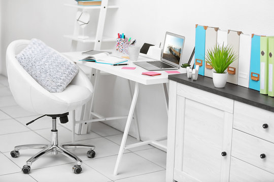 Stylish bright workplace in office