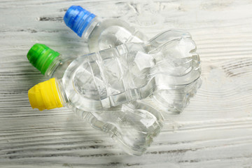 Bottled water on the wooden table, top view