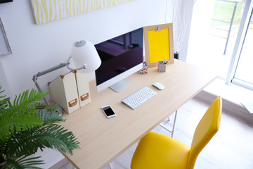 Stylish workplace with computer at home