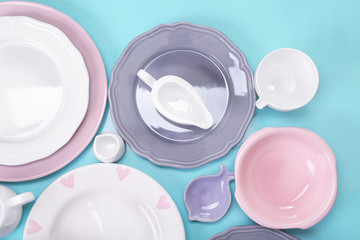 Empty dishes on blue background.