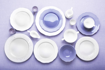 Empty dishes on grey background.